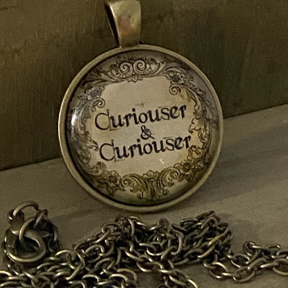 3/$25Curiouser & Curiouser Necklace Bronze